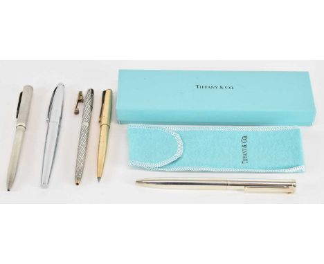TIFFANY &amp; CO; a 925 hallmarked silver ballpoint pen, in original dust bag and box, a Sheaffer sterling silver pen, with e