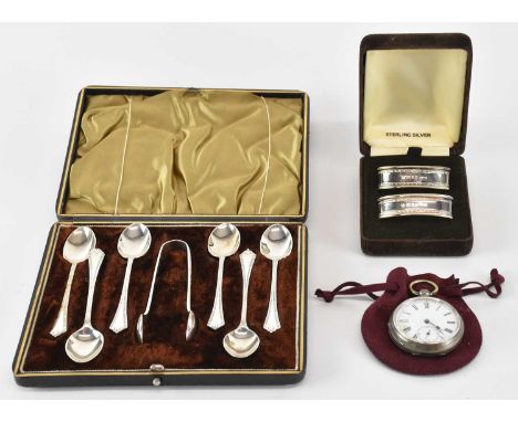 ARI D NORMAN; a cased pair of modern oval hallmarked silver napkin rings, London 1989, combined approx 0.53ozt/16.4g, a cased
