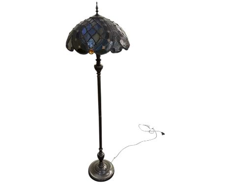 A modern bronzed standard lamp, with leaded glass Tiffany style shade, height 178cm.