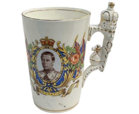 A rare 1937 Edward VIII Coronation mug, 'Young Crowned King of England', with crown moulded handle, height 10cm.