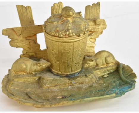 A gilded bronzed inkwell, modelled as a bin beneath a fence with snail atop the hinged lid flanked by a pair of rats, width 1