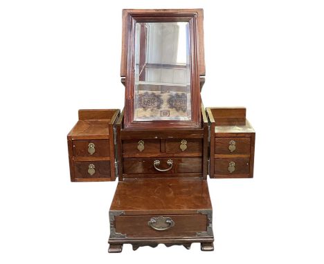 A reproduction South Korean shaving/toiletry box/cabinet, with brass bound fittings, mirror to the underside of the lid and o