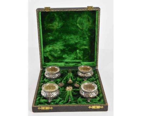 A cased set of four 800 grade silver open salts, with clear glass liners, three matching spoons and associated 800 grade spoo