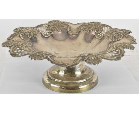 A large Victorian hallmarked silver fruit bowl on pedestal foot, the outer border decorated with open trellis and floral deta