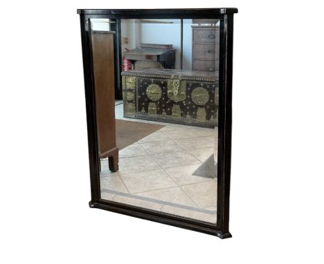 A modern ebonised bevelled glass wall mirror, 103 x 80cm.
