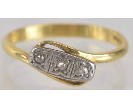 An 18ct gold ring, the table with three tiny illusion set diamonds in platinum, size N, approx 2g.