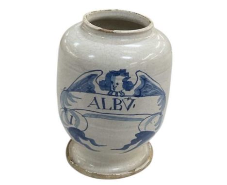 A late 18th/early 19th century tin glazed earthenware apothecary jar, with underglazed blue putti with wings covering the tex