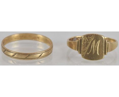 A 9ct gold signet ring, with diagonal floral pattern and the initial 'M', size O, approx 1.6g, also a 9ct gold textured band 