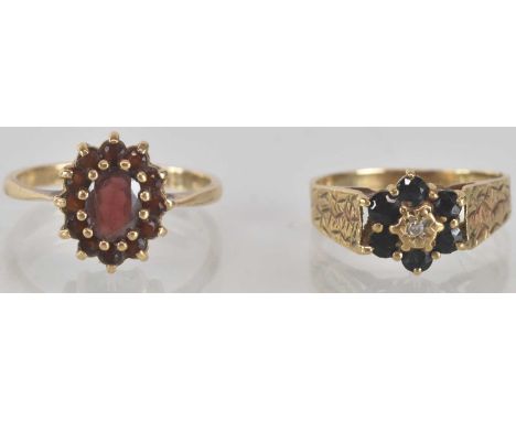 A 9ct gold garnet cluster ring, with central oval claw set garnet surrounded by tiny garnets, size P, and a 9ct gold 1970s di