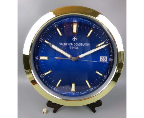 A decorative Vacheron Constantin style dealer's wall clock, the blue dial set with subsidiary seconds and date aperture and i