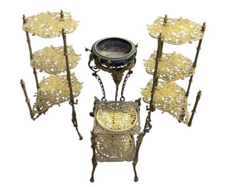 A pair of early 20th century brass three tier jardinière stands, height 76cm, diameter of top 30cm, a similar two tier jardin