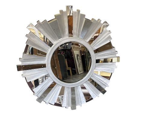 A modern circular sunburst type wall mirror, the silvered frame set with rectangular glass panels, diameter 107cm.