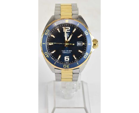 TAG HEUER; a gentleman's gold plated and stainless steel Formula 1 calendar bracelet wristwatch, the blue dial set with Arabi
