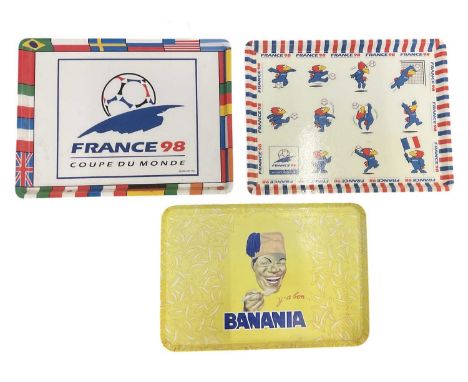 Two French 1998 Football World Cup commemorative plastic rectangular trays, both 46 x 35cm, and a Banania yellow plastic adve