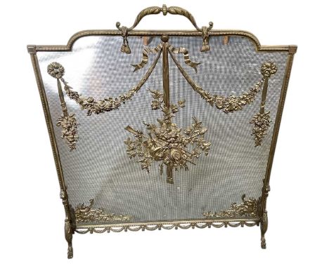A late 19th/early 20th century French gilt metal and ormolu mounted mesh grille firescreen, height 78cm, width 65cm.