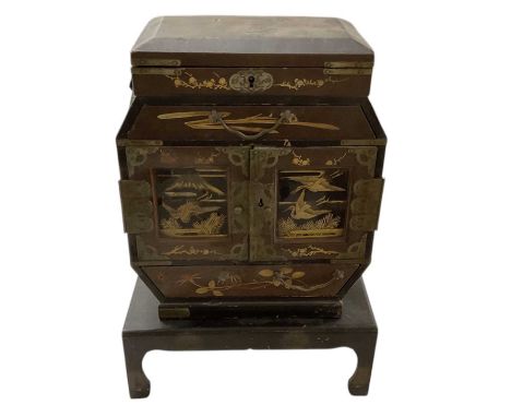 An early 20th century Japanese black lacquered tabletop trinket/jewellery box, decorated with birds amongst scrolling foliage