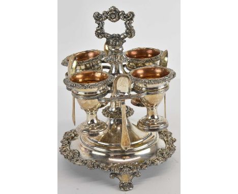 A Victorian silver plated set of four egg cups with gilt washed interiors on plated stand with borders of floral bouquets, ra