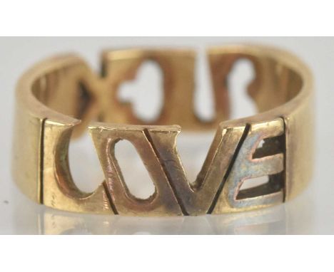 A yellow metal band ring, inscribed 'F*ck Love', size M, approx 3.6g.