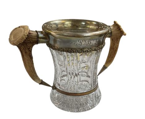 A large fine and impressive loving cup, the finely cut glass body featuring vertical lens cuts, serrated vertical lines, mult