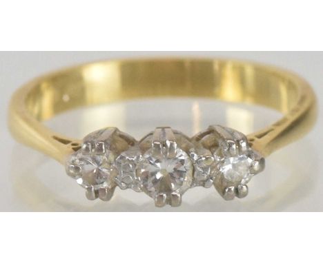 An 18ct gold three stone diamond set ring, size O, approx 3.2g.