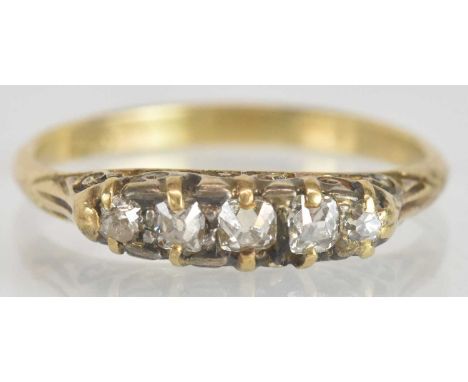 An 18ct yellow gold diamond four stone ring, size N, approx 2.3g.