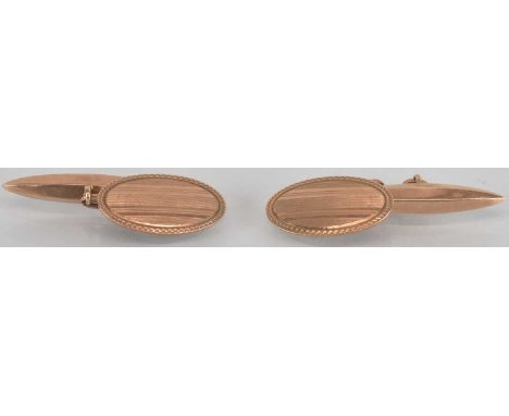 A pair of 9ct yellow gold oval cufflinks, with engine turned decoration, combined approx 5.4g.
