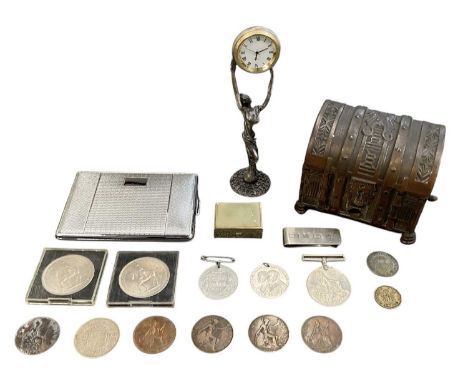 A group of collectables including a cigarette dispenser in the form of a treasure chest, with side lever dispensing cigarette