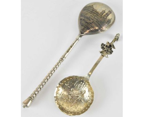 A Russian white metal and niello spoon, the reverse of the bowl decorated with castles and buildings, length 18.5cm, and a Co