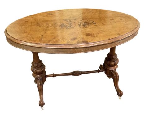 A Victorian walnut oval centre table, on ceramic castors, top 108 x 70cm.