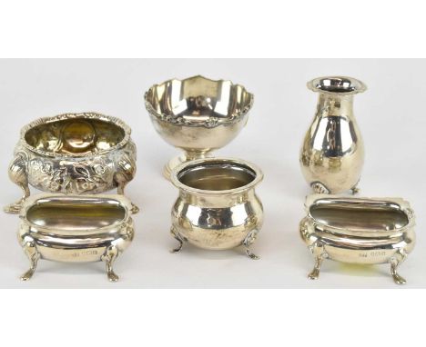 Six items of hallmarked silver comprising a pair of salts (lacking liners), three separate salts and a pepperette (lacking li