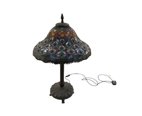 IN THE STYLE OF TIFFANY &amp; CO; a modern black painted table lamp, with leaded glass shade, height 74cm.