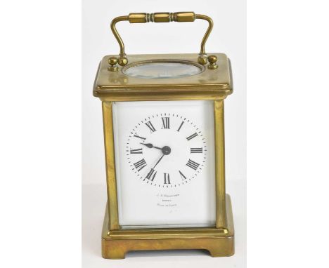 J V WOODWARD OF DERBY; a French brass cased carriage clock, the white enamel dial set with Roman numerals and maker's name an