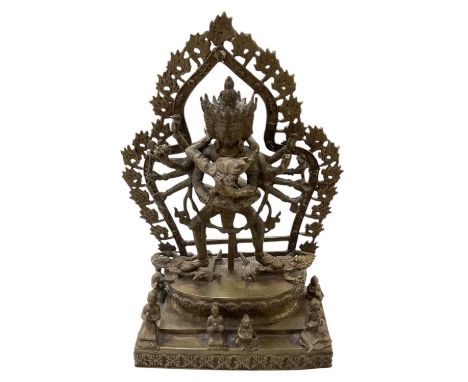 A modern Indian bronze figure of Shiva, on stand, surrounded by praying figures, height 40cm.
