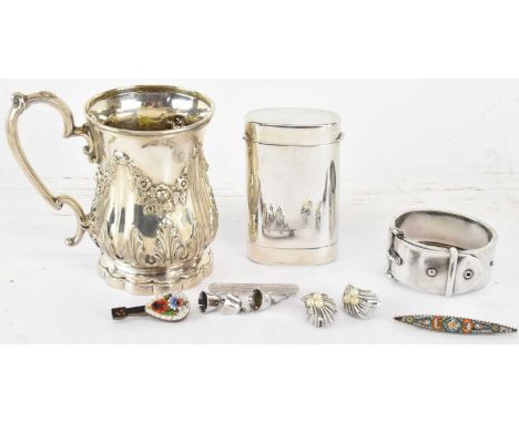 A group of seven small silver items comprising an 800 grade oval cigarette case, with atlas detail to the bottom, 9.5 x 5.5cm