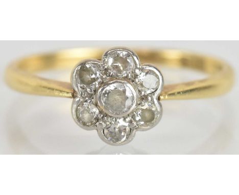 An 18ct yellow gold diamond flower head cluster ring, size O, approx 2.3g.