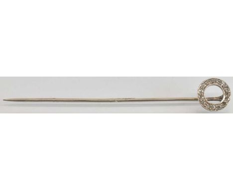 A white metal diamond set stick pin, the circular diamond set top approx diameter 1cm, length 7cm, approx 1.9g.