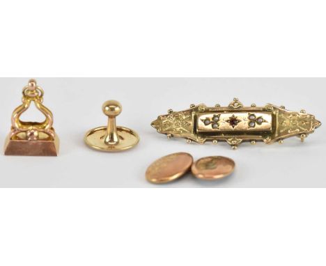 A Victorian 9ct yellow gold red stone and seed pearl set bar brooch, length 4cm, a 9ct yellow gold seal pendant, a 9ct yellow