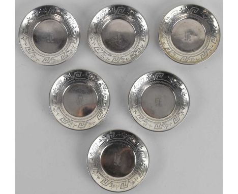 Six small Middle Eastern sterling silver dishes with repeating pattern to the border and central initial 'h', diameter 7cm, c