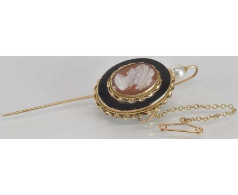 A late 19th/early 20th century 9ct gold lapel pin, with bezel set oval cameo of the head and shoulders of a lady, within a go