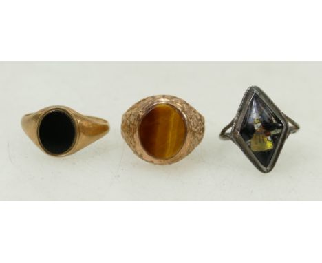 2 x 9ct gold gents rings:Tigers eye &amp; black onyx set gents 9ct gold rings 8.8 gross inc stones, plus silver ring. (3)