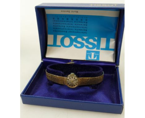 Tissot ladies gold watch:  Hallmarked 9ct gold watch with 9ct gold bracelet 24g gross, complete with box. Ticking order.