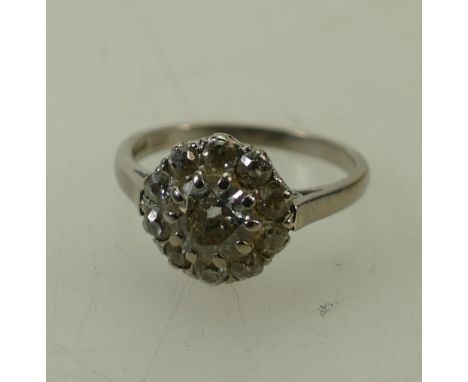 18ct white gold diamond cluster: Diamond ring with old cut centre stone 0.75ct approx, surrounded by 10 small diamonds, appro