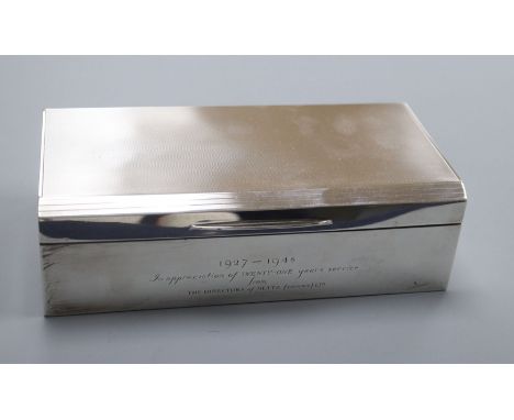 A silver rectangular cigarette box, London 1947, Plante &amp; Bannister, London, engine-turned and reeded, with engraved insc