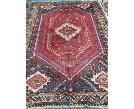 A Shiraz carpet 310 x 216cm