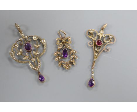 Three assorted Edwardian yellow metal and gem set drop pendants, including amethyst, two stamped 9ct, largest 49mm.