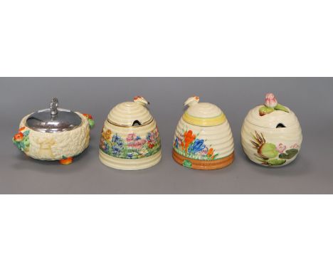 Four Clarice Cliff preserve jars