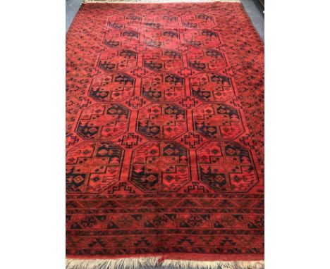 An Afghan carpet 365 x 254cm