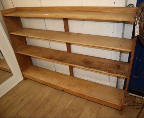 An Arts &amp; Crafts pine three shelf open bookcase, with pegged joints W.168cm