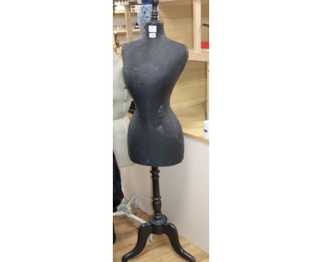 A dress maker's dummy, on tripod base