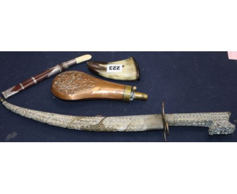 An Eastern plate-mounted dagger with inlaid blade and filigree decoration, a Burmese dha, an embossed copper powder flask and